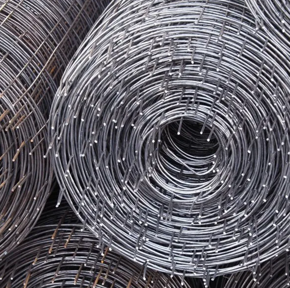 Rolled metal wire mesh, close-up view. Rolled metal wire mesh, close-up view.