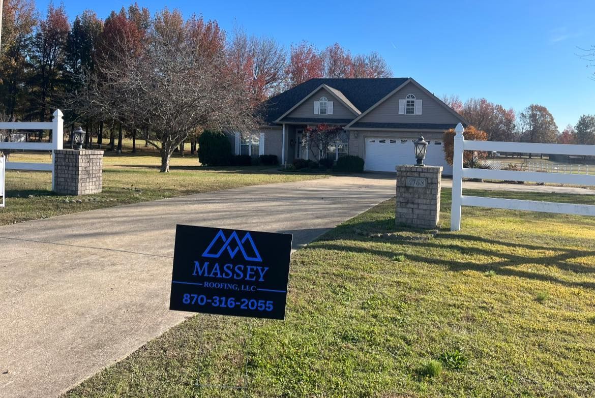 massey roofing sign in front of home