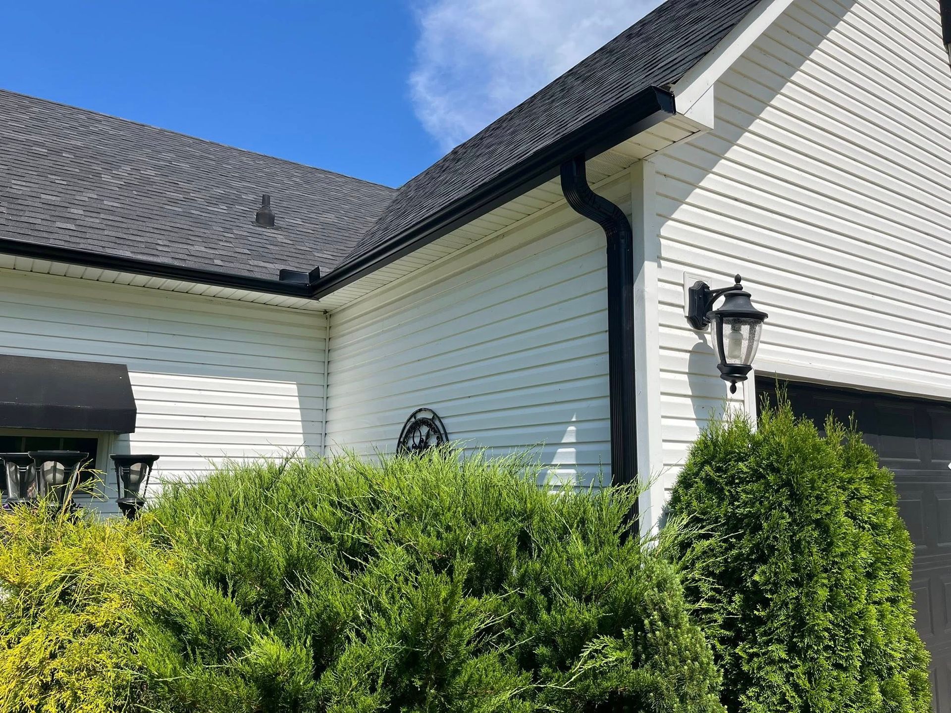 gray shingle roof on white house