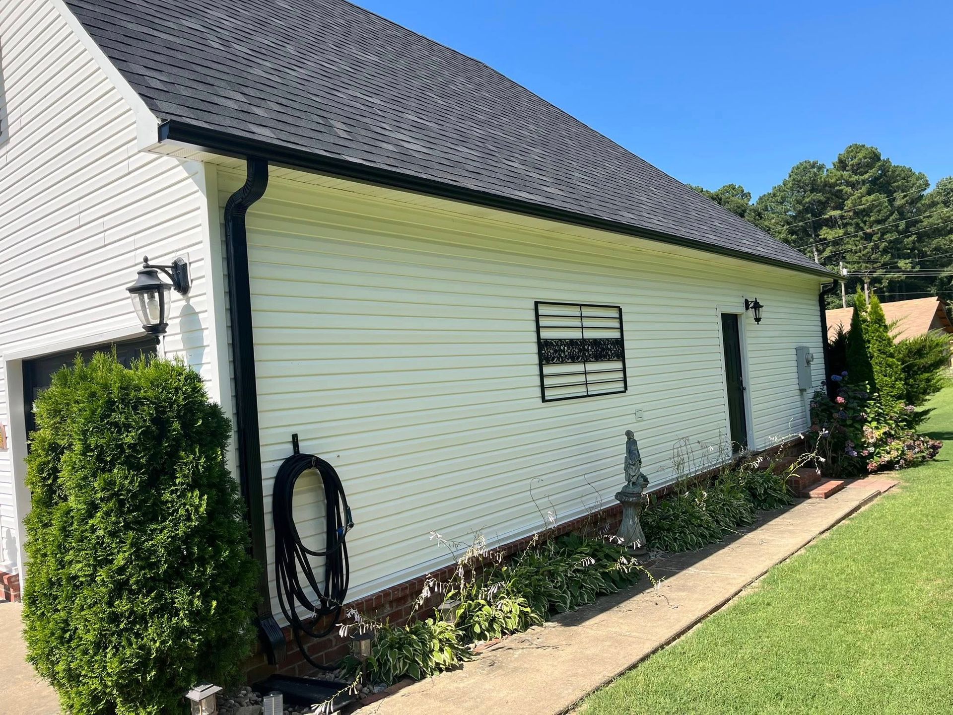 gray shingle roof on white house