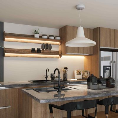 A kitchen with wooden cabinets and a gray counter top