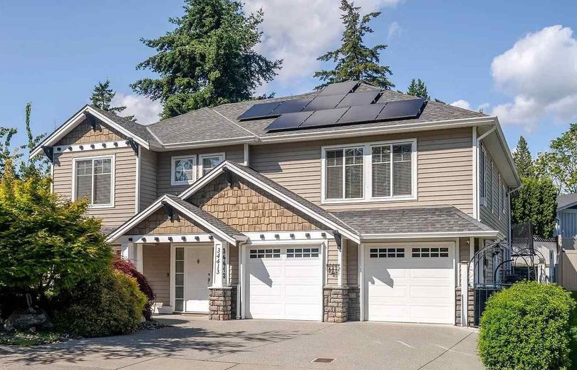 A large brick house with a white garage door