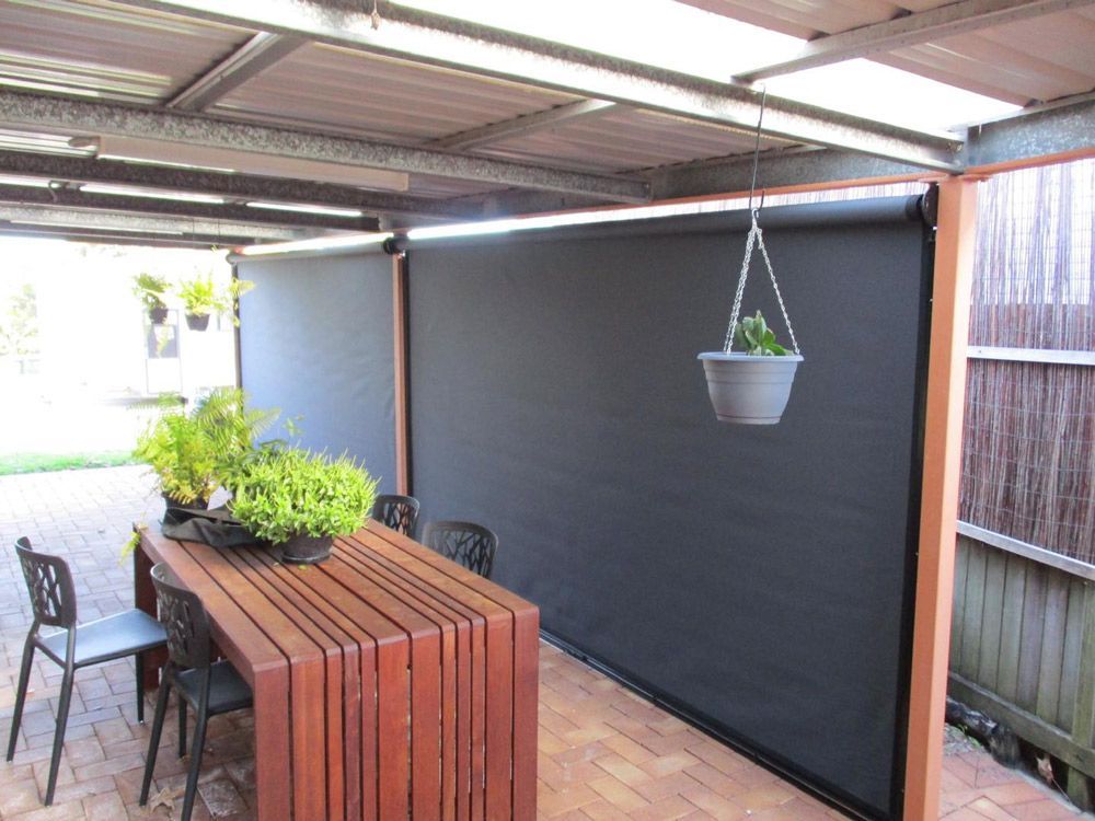 An Outdoor Living Space With Blinds