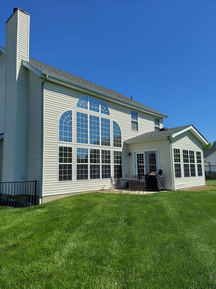 Window Cleaning a 2 story house with many  glass panes