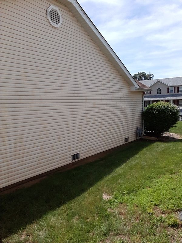 House with clean vinyl siding; still wet