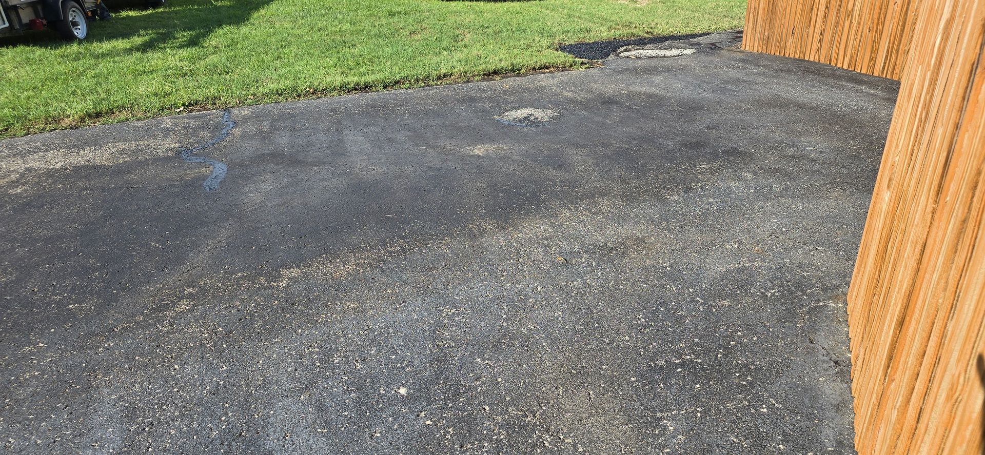 Oil Stained Asphalt Driveway in Mascoutah, IL