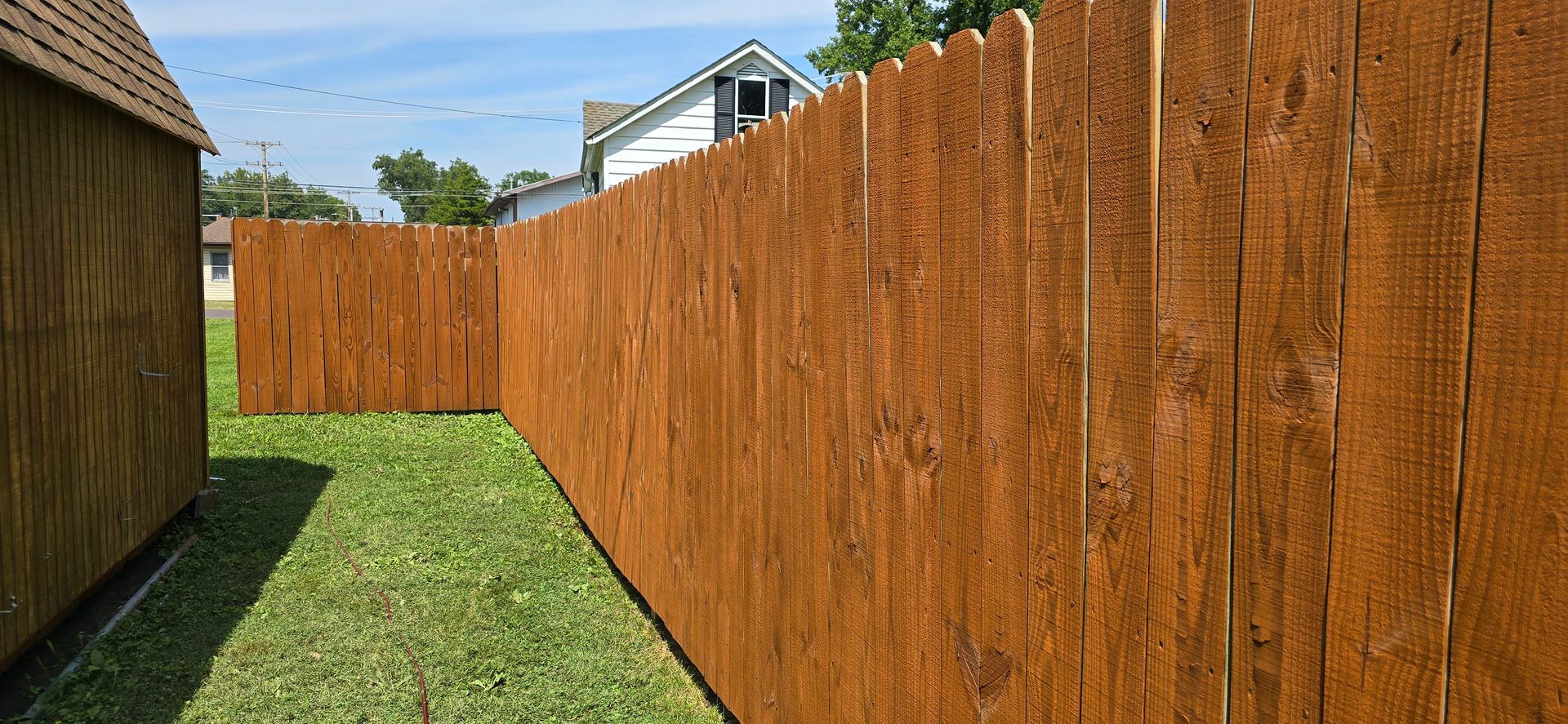 SprytNa Exterior Cleaning: Wood fence staining in Mascoutah, IL using Stain and Seal Experts Auburn semi-solid stain.