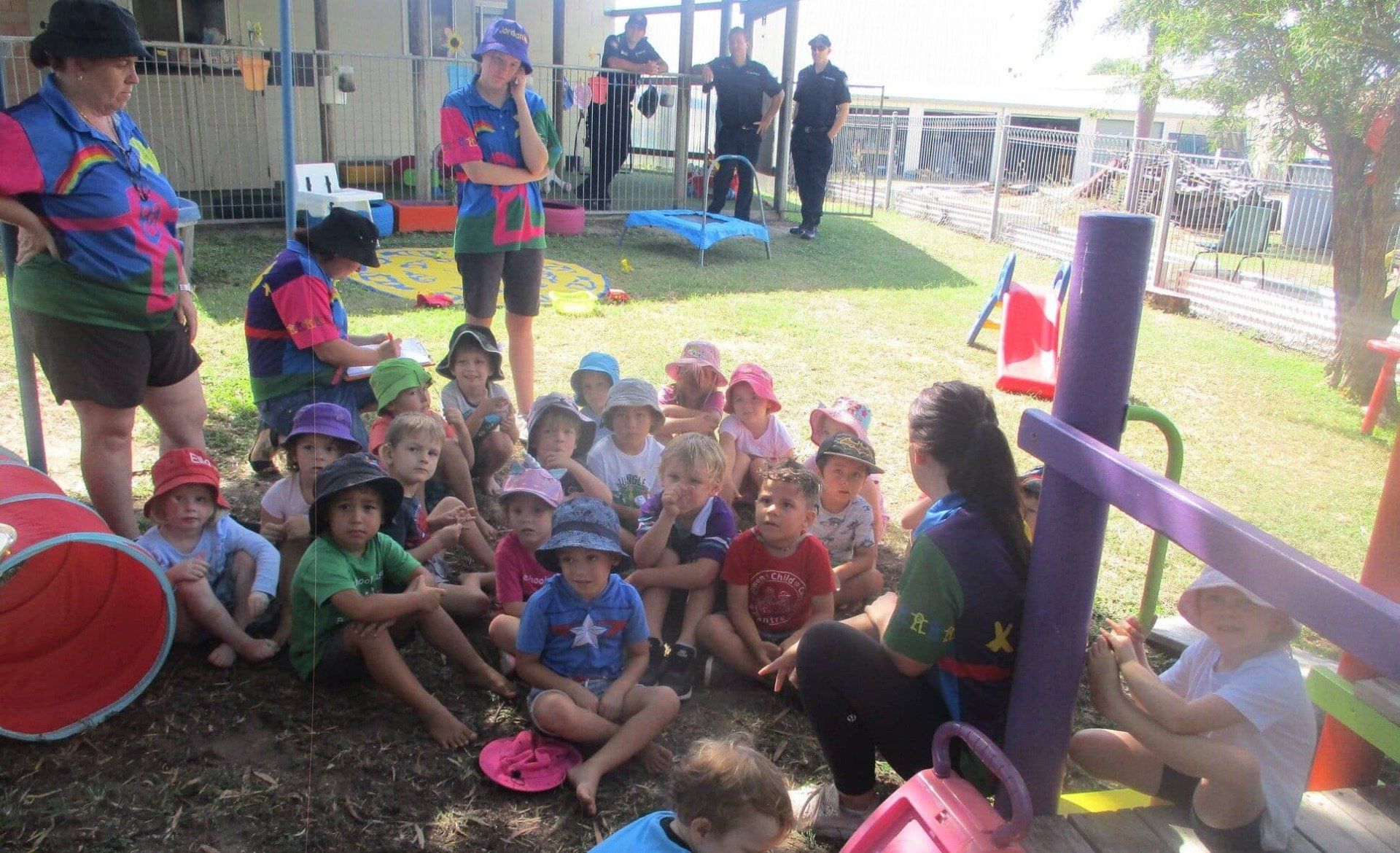 Kids Sitting On Playground — Child Care in Bowen, QLD