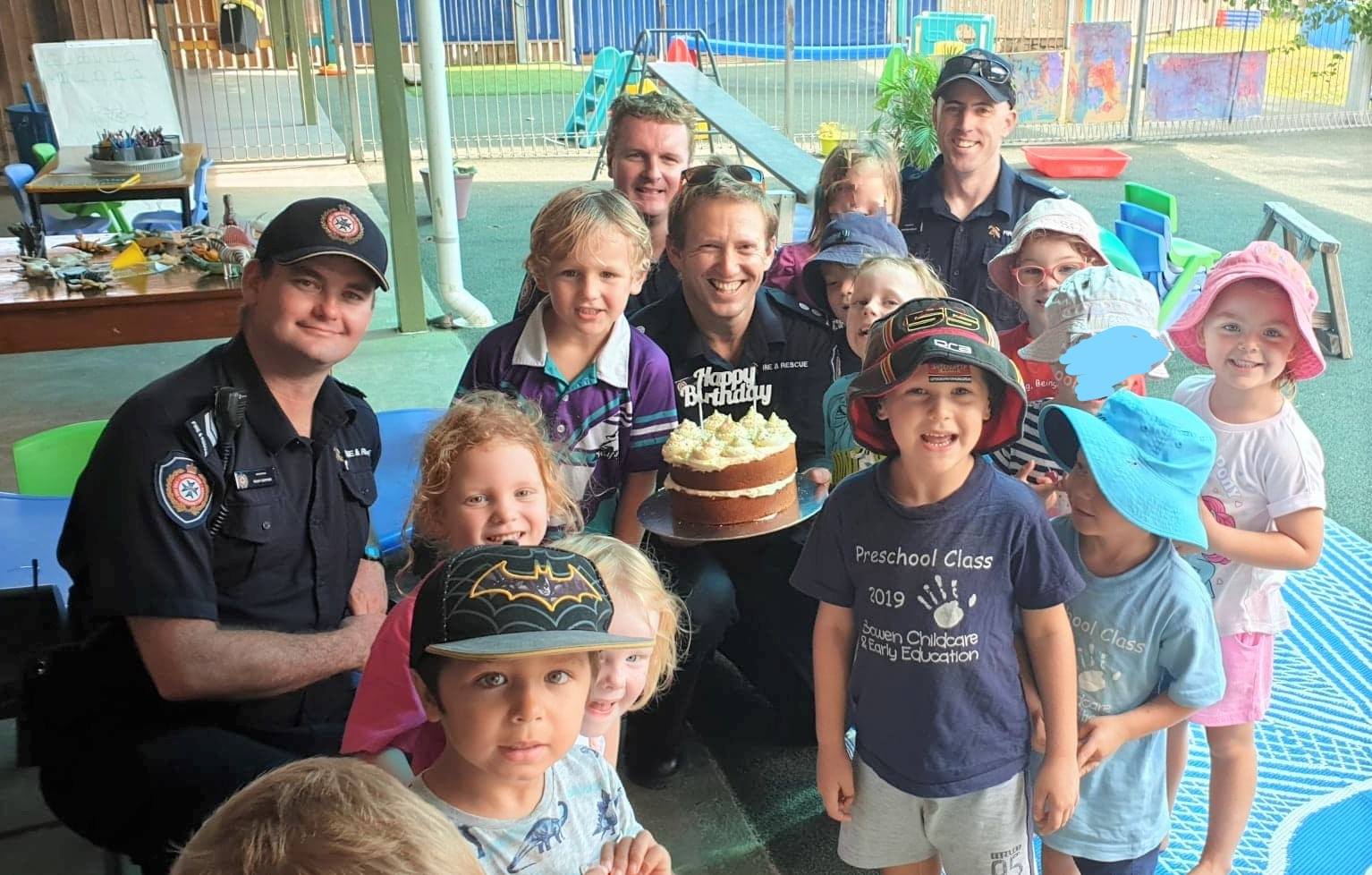 Firefighters & Kids With Cake — Child Care in Bowen, QLD