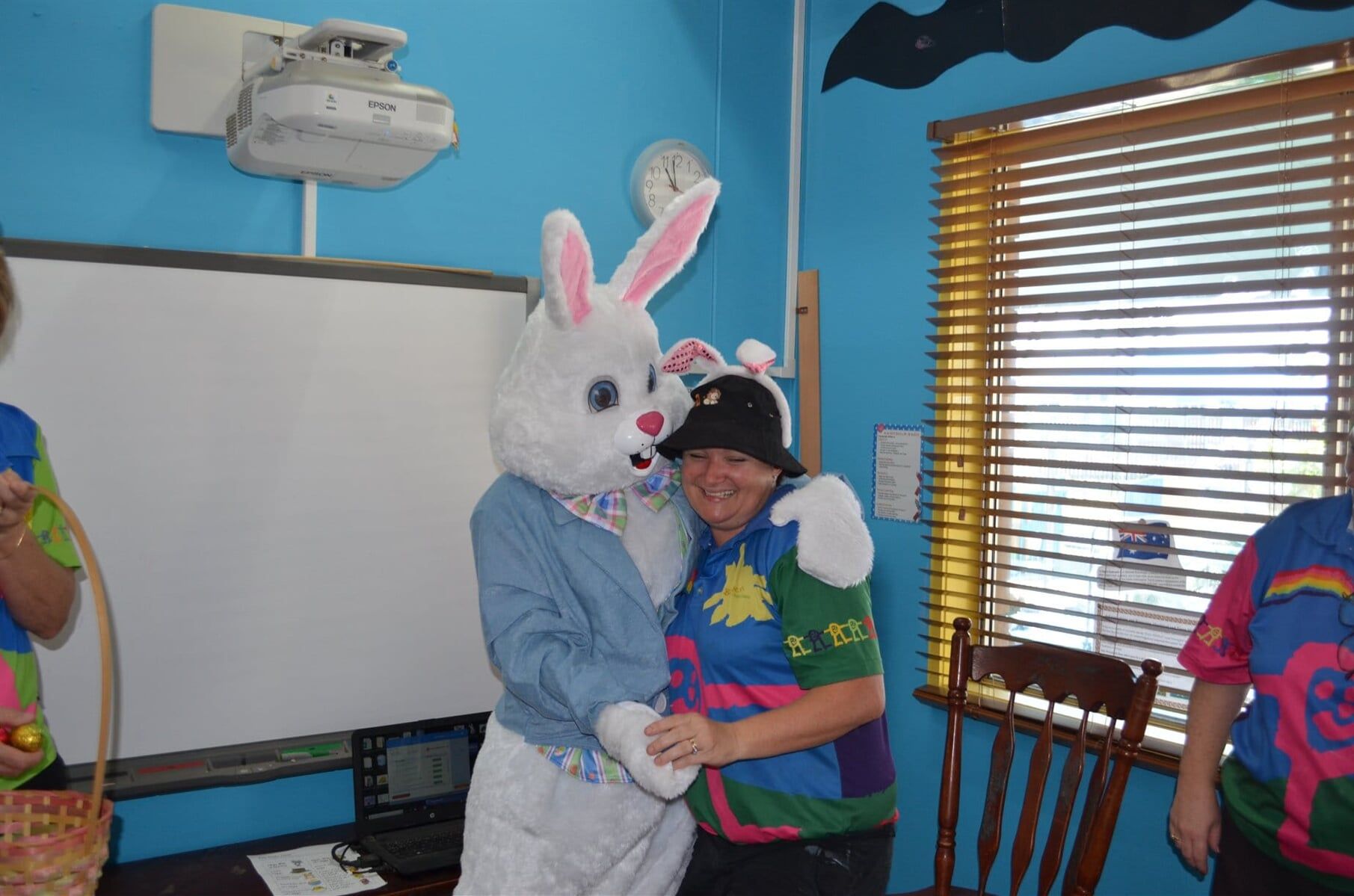 Easter Bunny Hugging Teacher — Child Care in Bowen, QLD