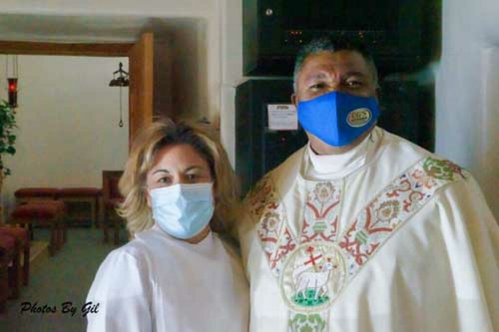 A clergy member in ornate vestments.