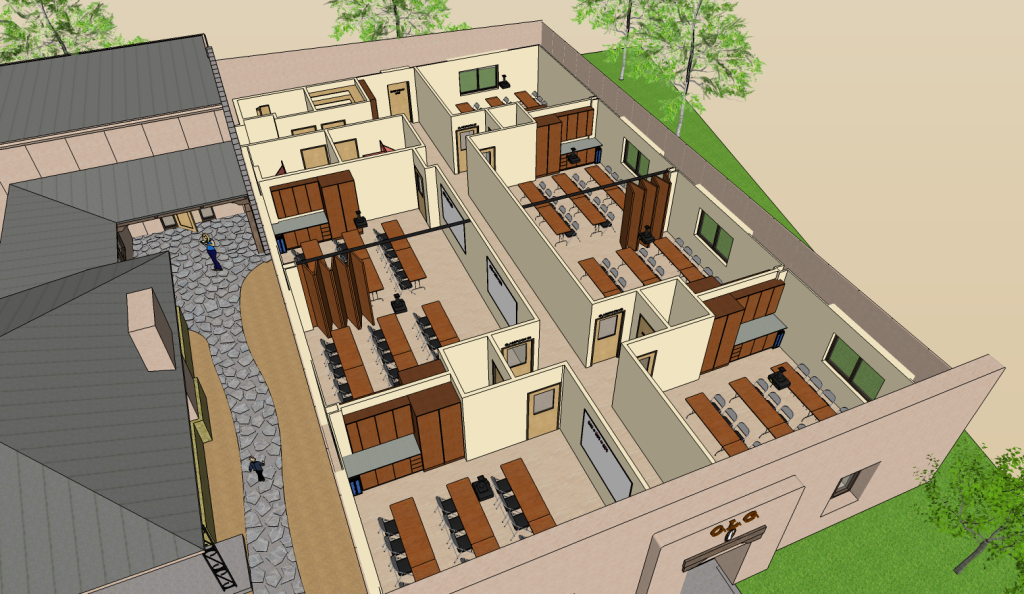 Overhead view of a building floor plan with multiple rooms, arranged around a central corridor.