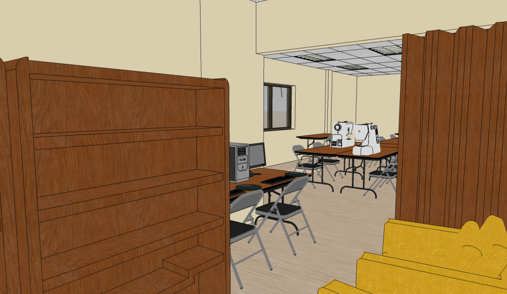 A room setup with sewing machines on long tables, folding chairs, and a wooden bookcase.