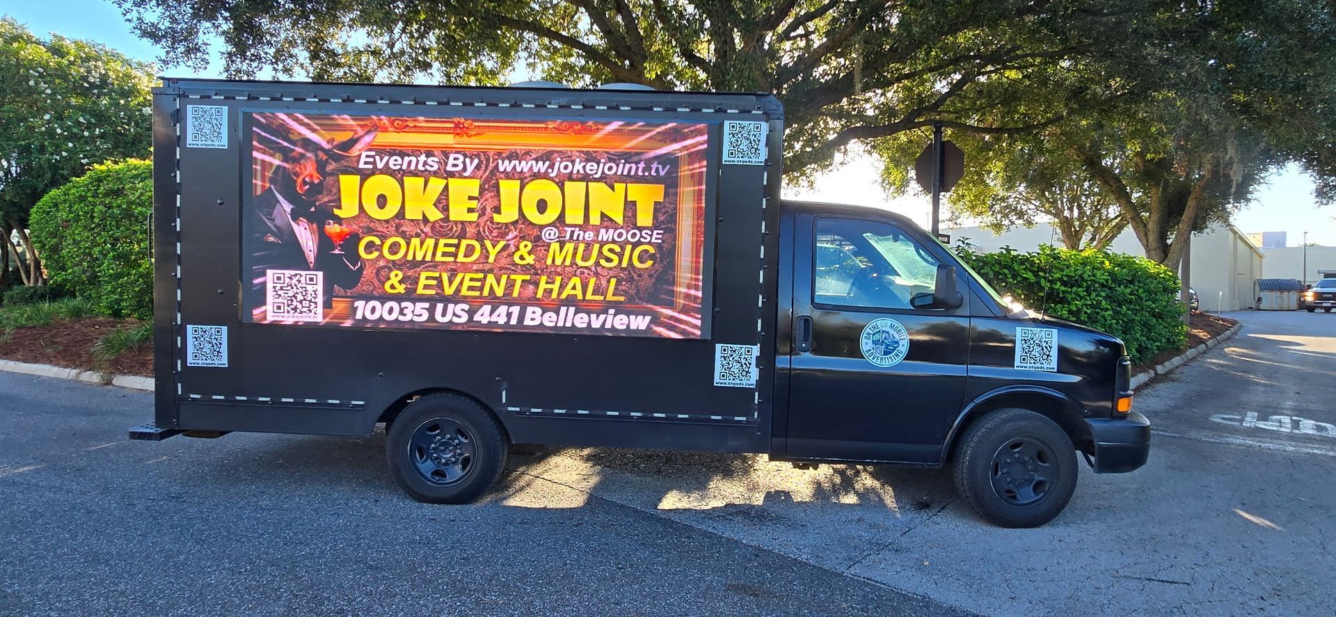 Black truck with a digital display advertising 
