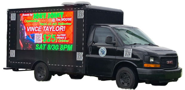 Black advertising truck with an LED screen promoting a show featuring Vince Taylor.