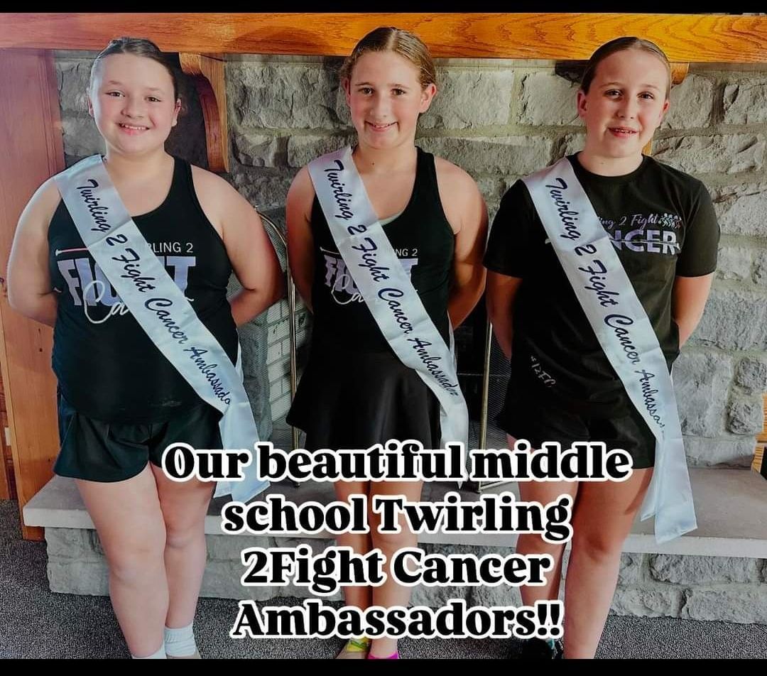 Three girls wearing sashes that say our beautiful middle school twirling 2 fight cancer ambassadors