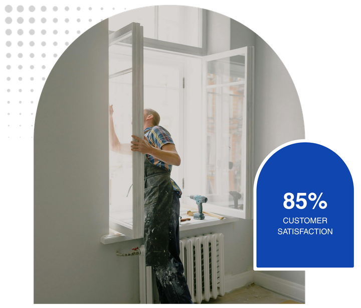 Man installing a window, a customer satisfaction score of 85% is displayed on a blue background.
