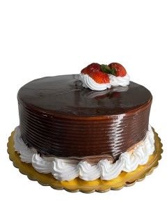 A chocolate cake with whipped cream and strawberries on top.