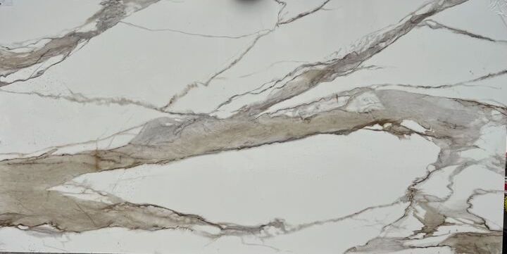 A close up of a gray concrete wall with a marble texture.