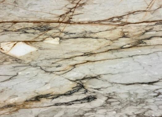 A close up of a white marble counter top.