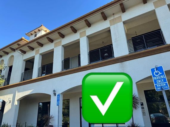 A building with a green check mark in front of it