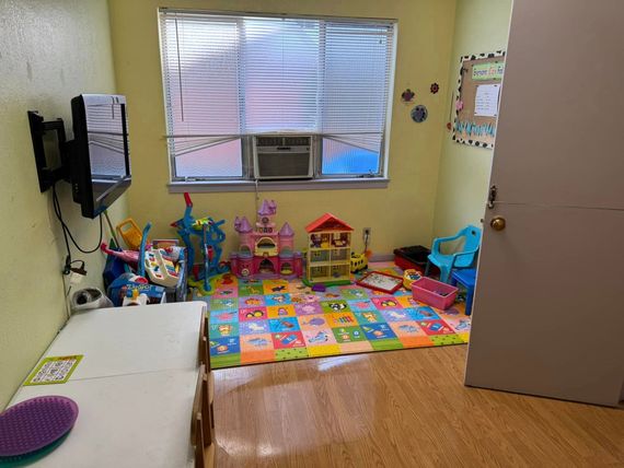 A room filled with lots of toys and a television.
