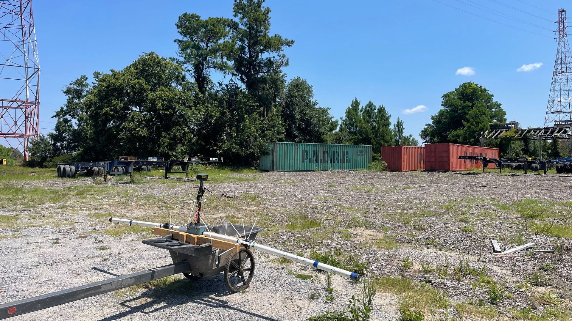 Geophysics Surveying equipment siting on site with cargo containers in the background