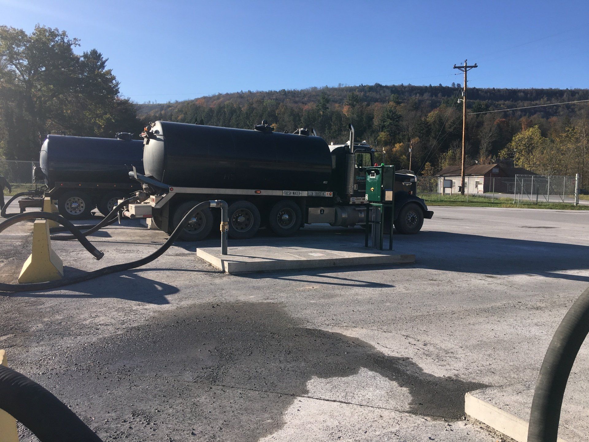 Tanker filling up at unmanned water station