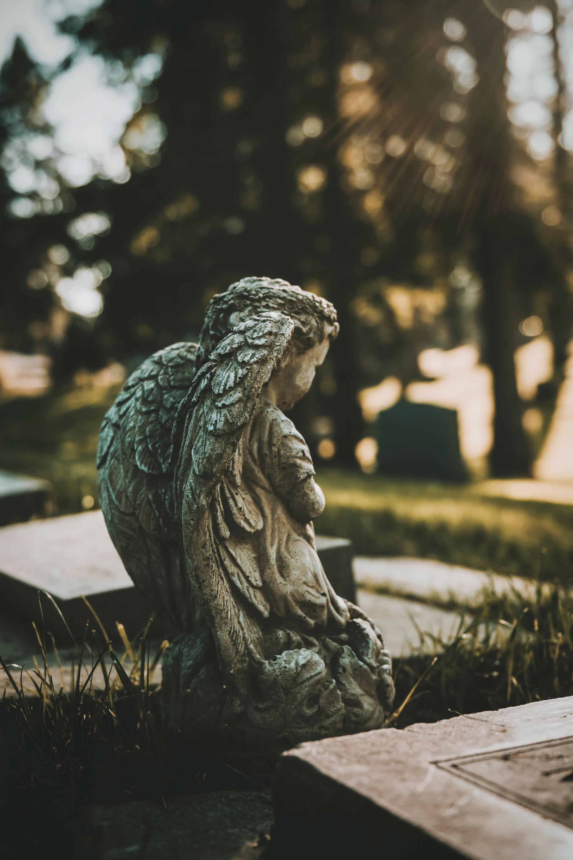 how to plan a burial angel statue