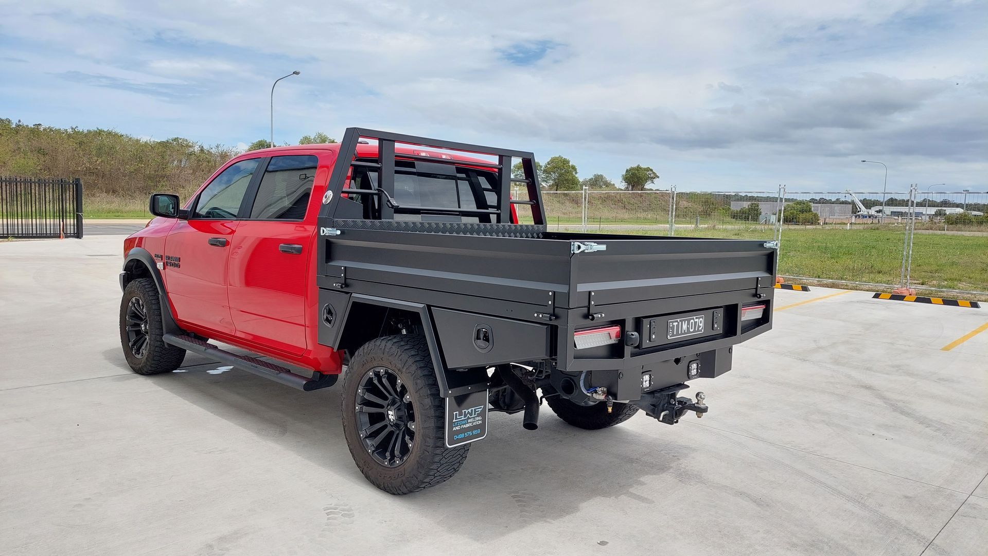 Red Pickup Truck With a Black Utility Tray — Litzow’s Welding & Fabrication in Dundowran, QLD