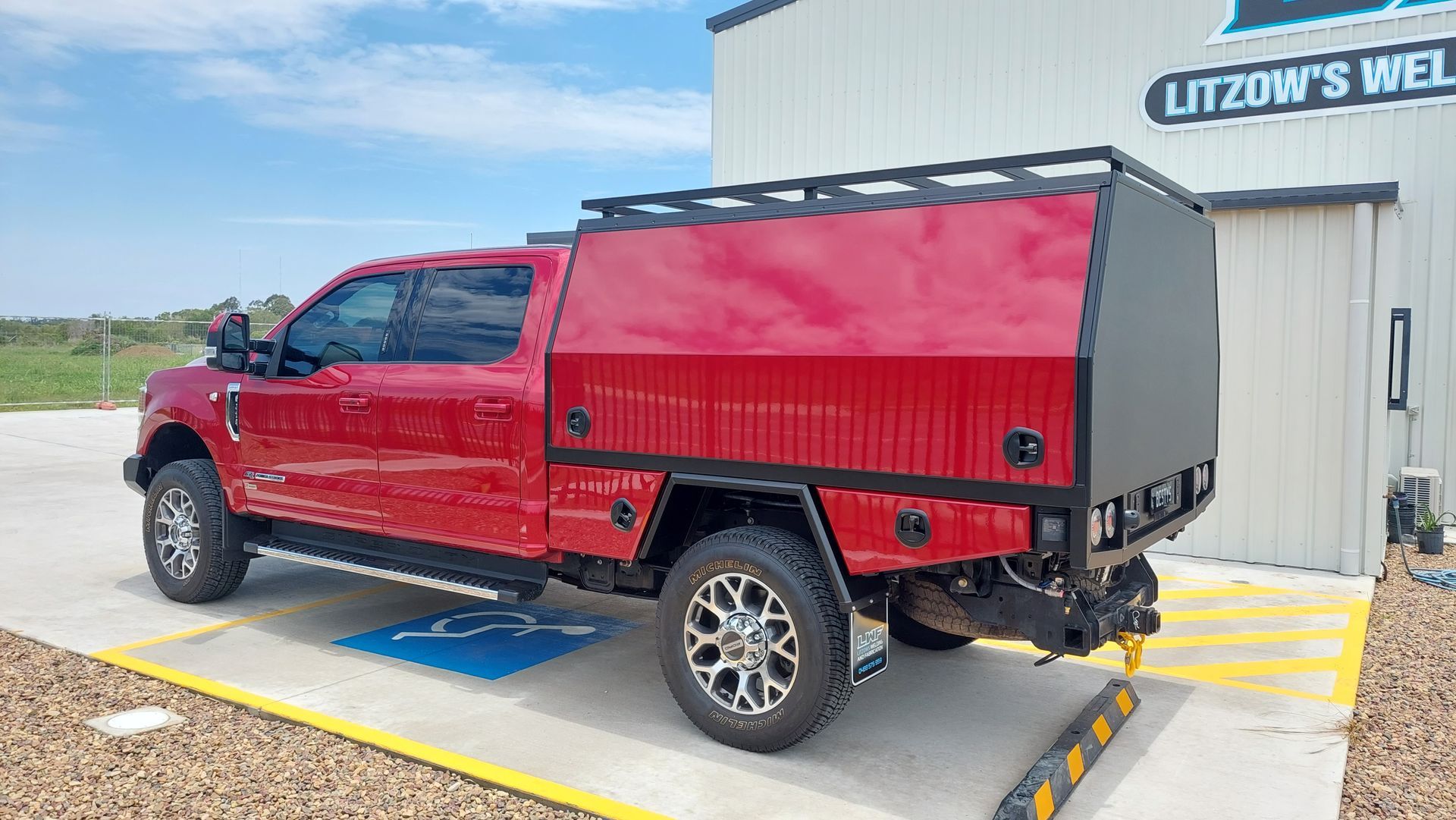 Red Pickup Truck With Black Utility Bed — Litzow’s Welding & Fabrication in Dundowran, QLD