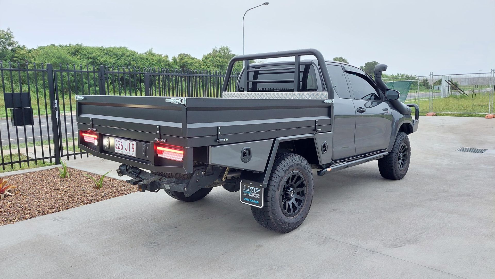 Black Pickup Truck With Flatbed — Litzow’s Welding & Fabrication in Dundowran, QLD