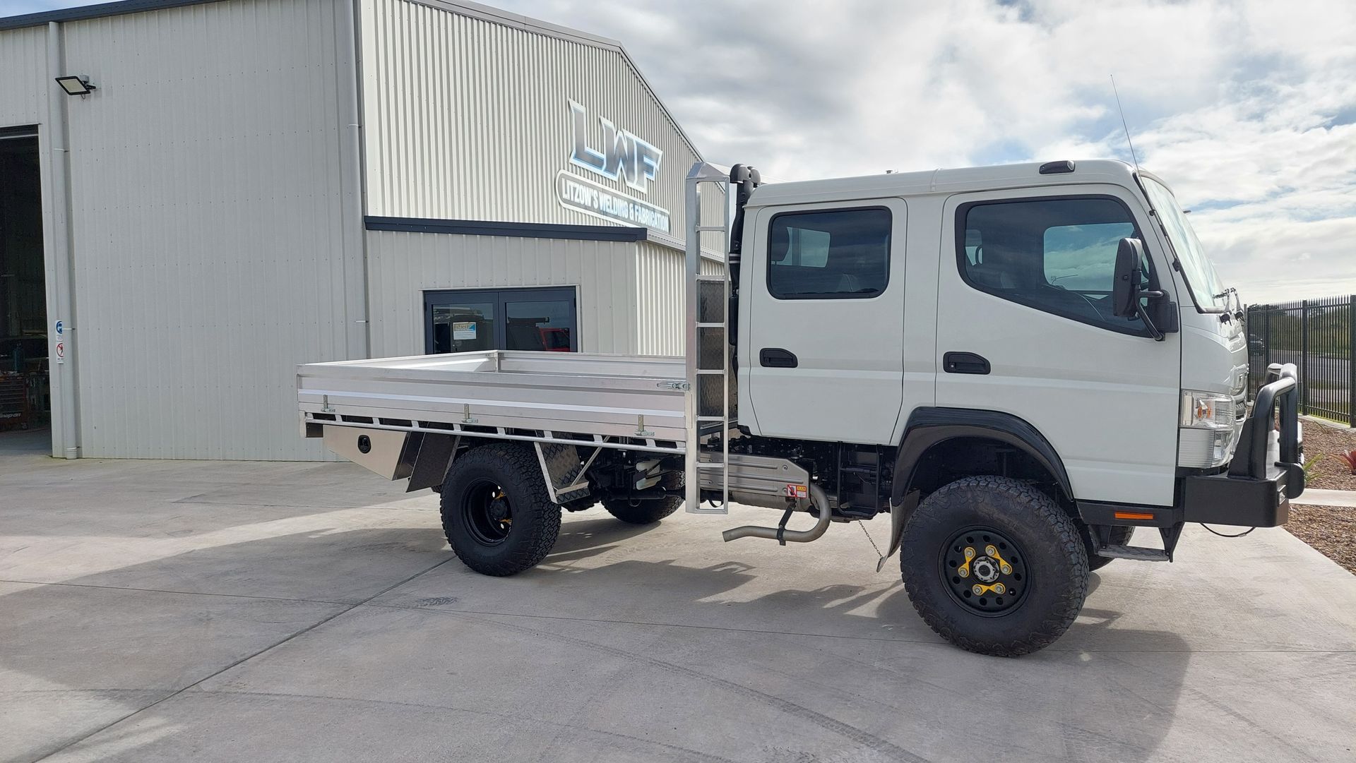 White Truck With a Flatbed — Litzow’s Welding & Fabrication in Dundowran, QLD