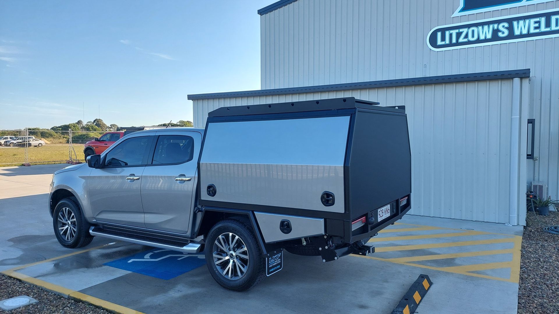 Silver Pickup Truck With Black and Silver Canopy Parked — Litzow’s Welding & Fabrication in Dundowran, QLD