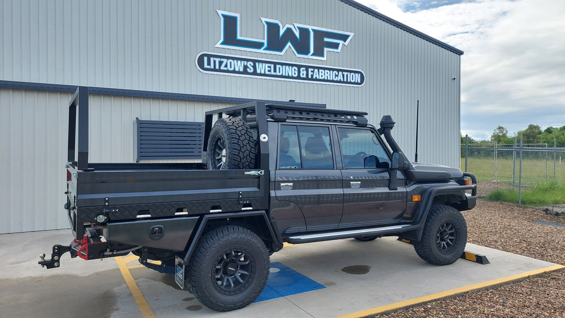 Black Off-road Truck With a Custom Tray Parked — Litzow’s Welding & Fabrication in Dundowran, QLD