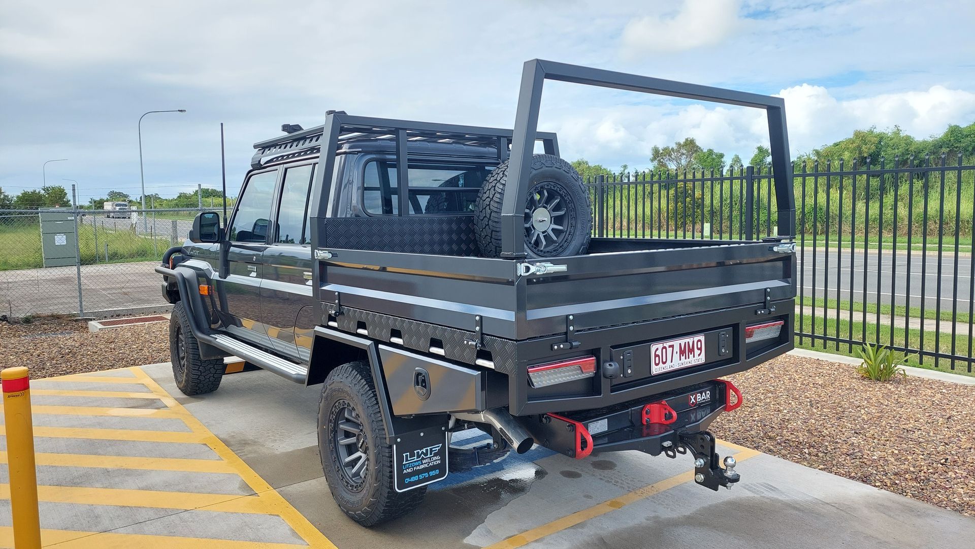 Black Utility Truck With Custom Flatbed — Litzow’s Welding & Fabrication in Dundowran, QLD