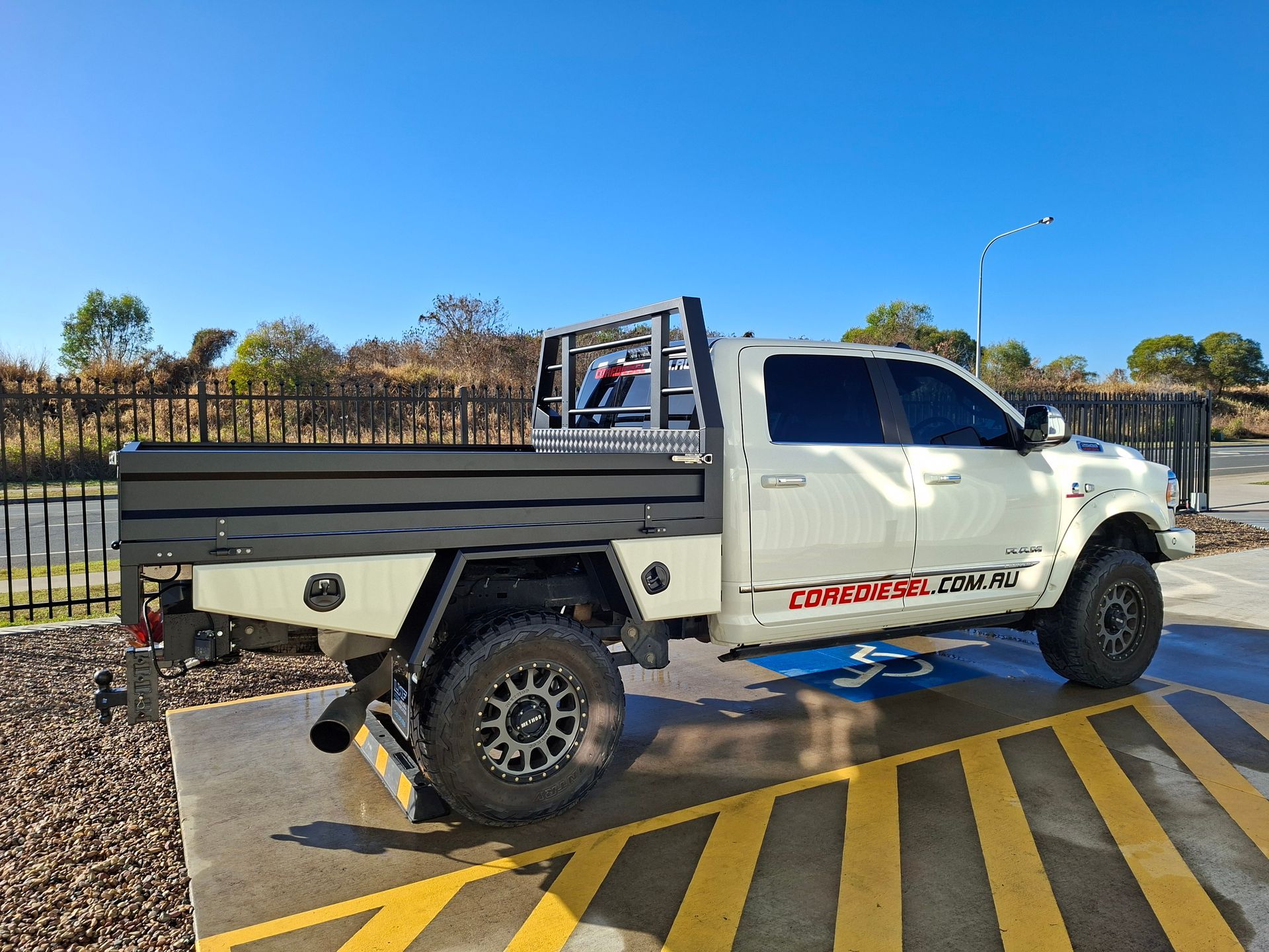 White Ram Pickup Truck With Black Flatbed — Litzow’s Welding & Fabrication in Dundowran, QLD