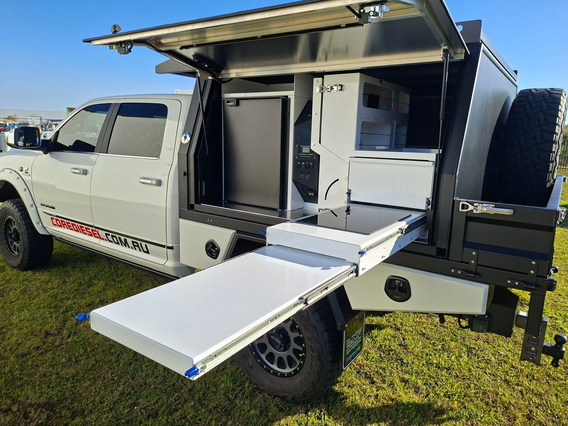 White Pickup Truck With a Camper Top — Litzow’s Welding & Fabrication in Dundowran, QLD