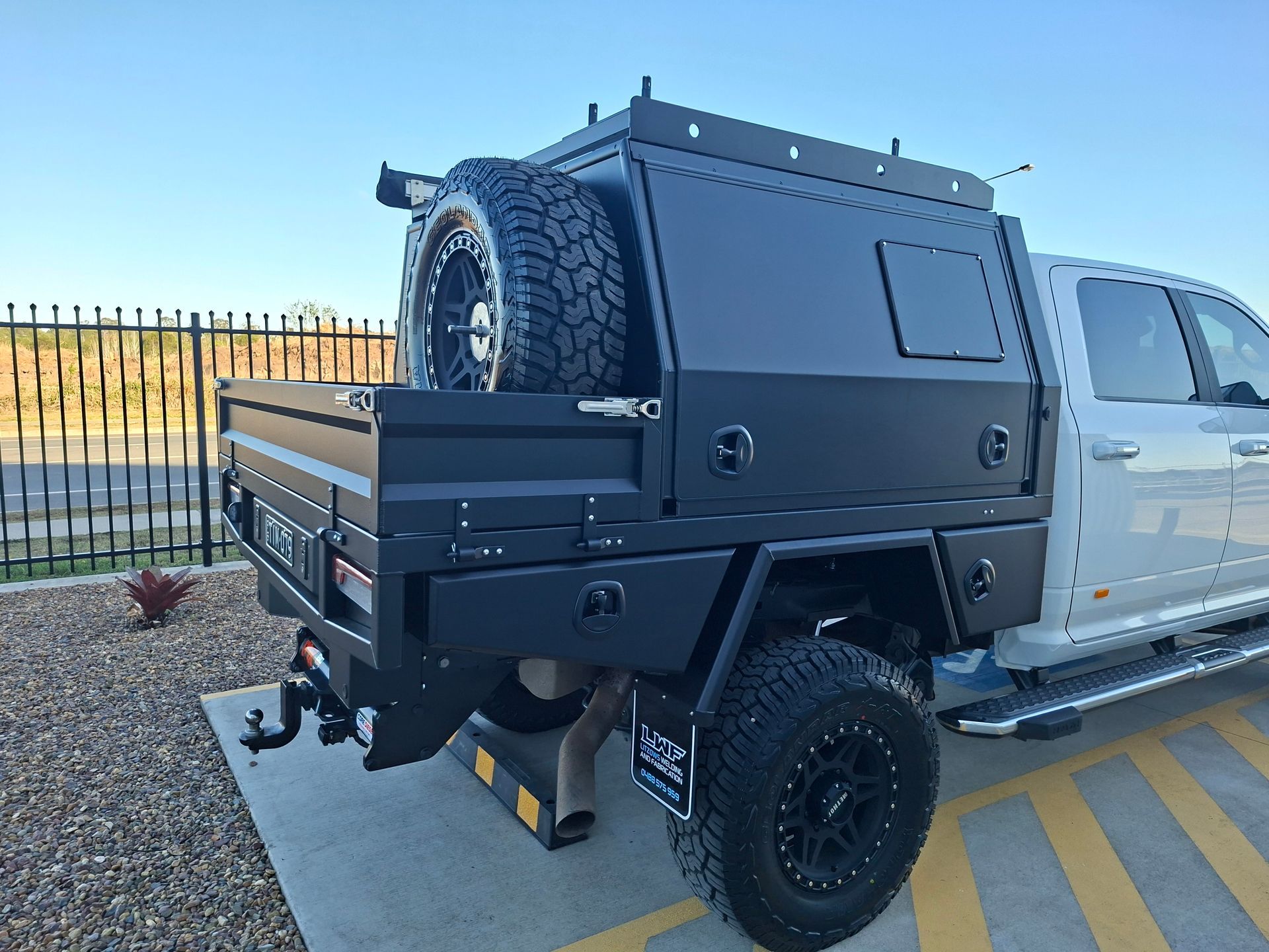 Black Utility Truck Bed With Canopy and Spare Tire — Litzow’s Welding & Fabrication in Dundowran, QLD
