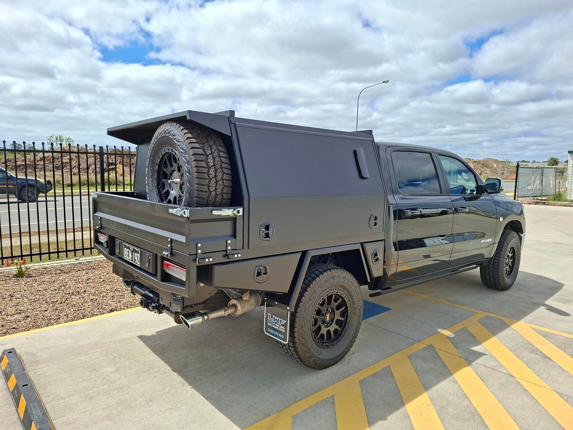 Black Pickup Truck With a Utility Bed — Litzow’s Welding & Fabrication in Dundowran, QLD