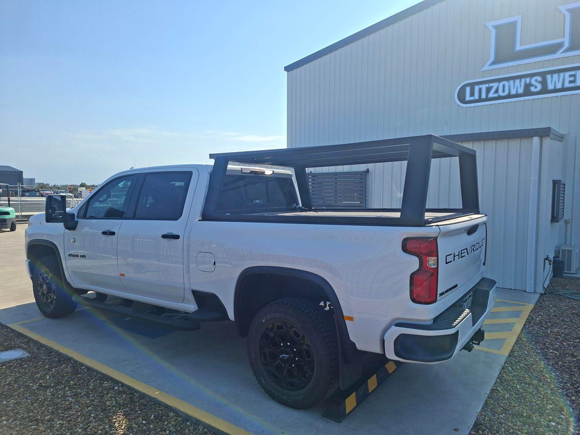 White Pickup Truck With Black Roof Rack Parked — Litzow’s Welding & Fabrication in Dundowran, QLD