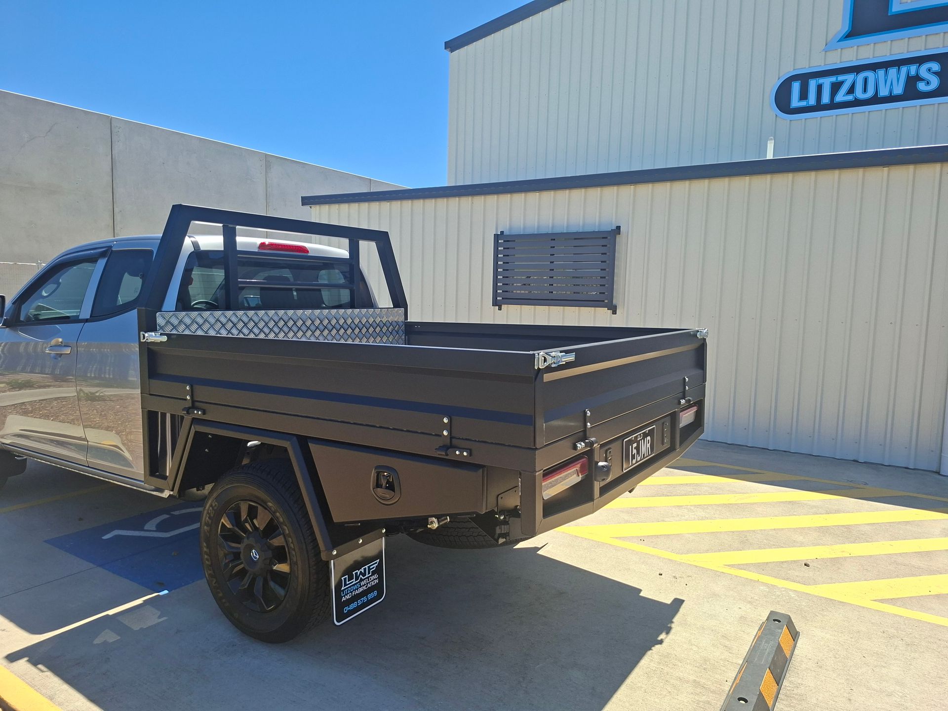 Black Utility Truck Bed Parked — Litzow’s Welding & Fabrication in Dundowran, QLD