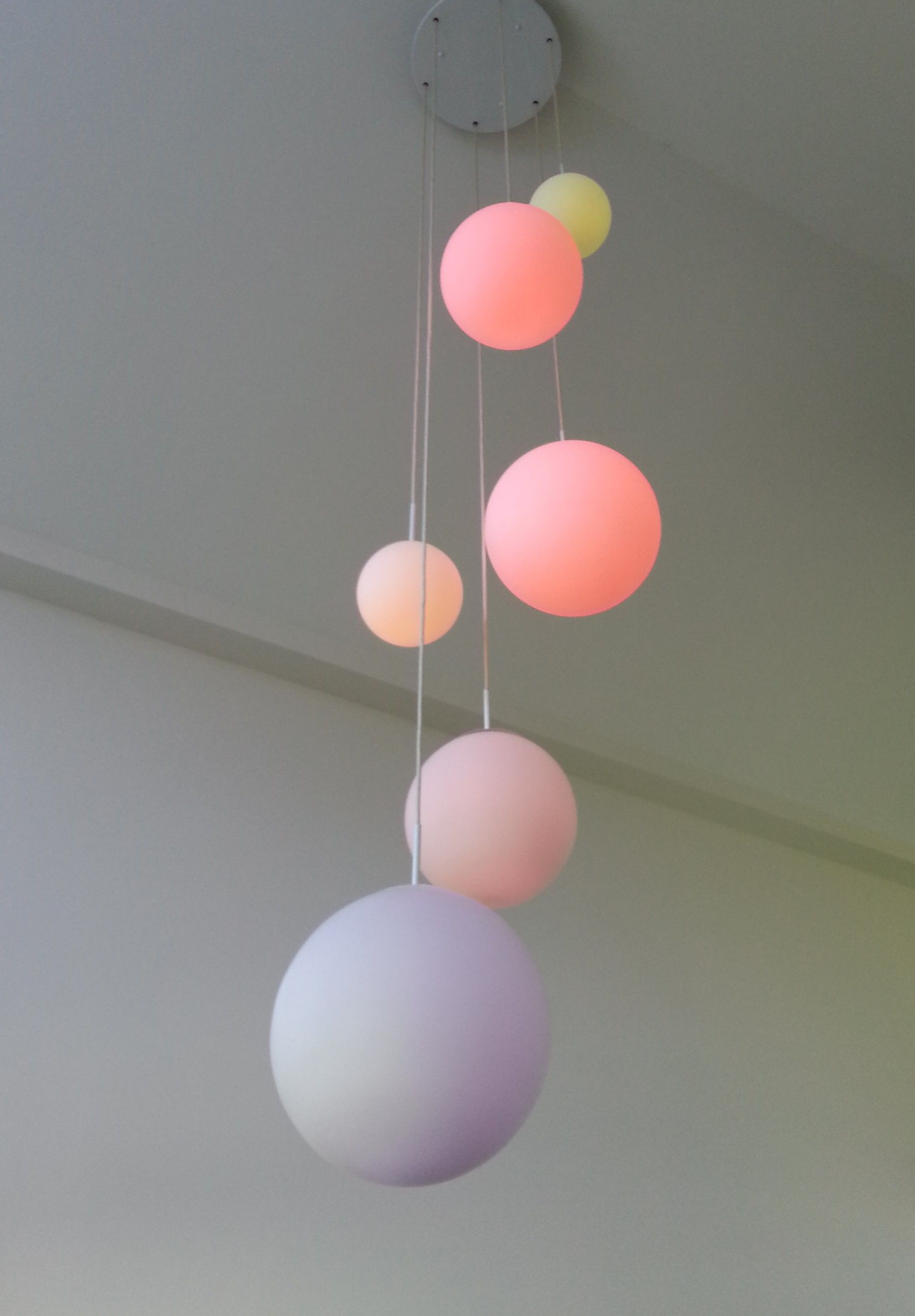 A Person is Holding a Piece of Electronic Equipment in Front of a Car — Riselectrical In Currumbin Waters, QLD