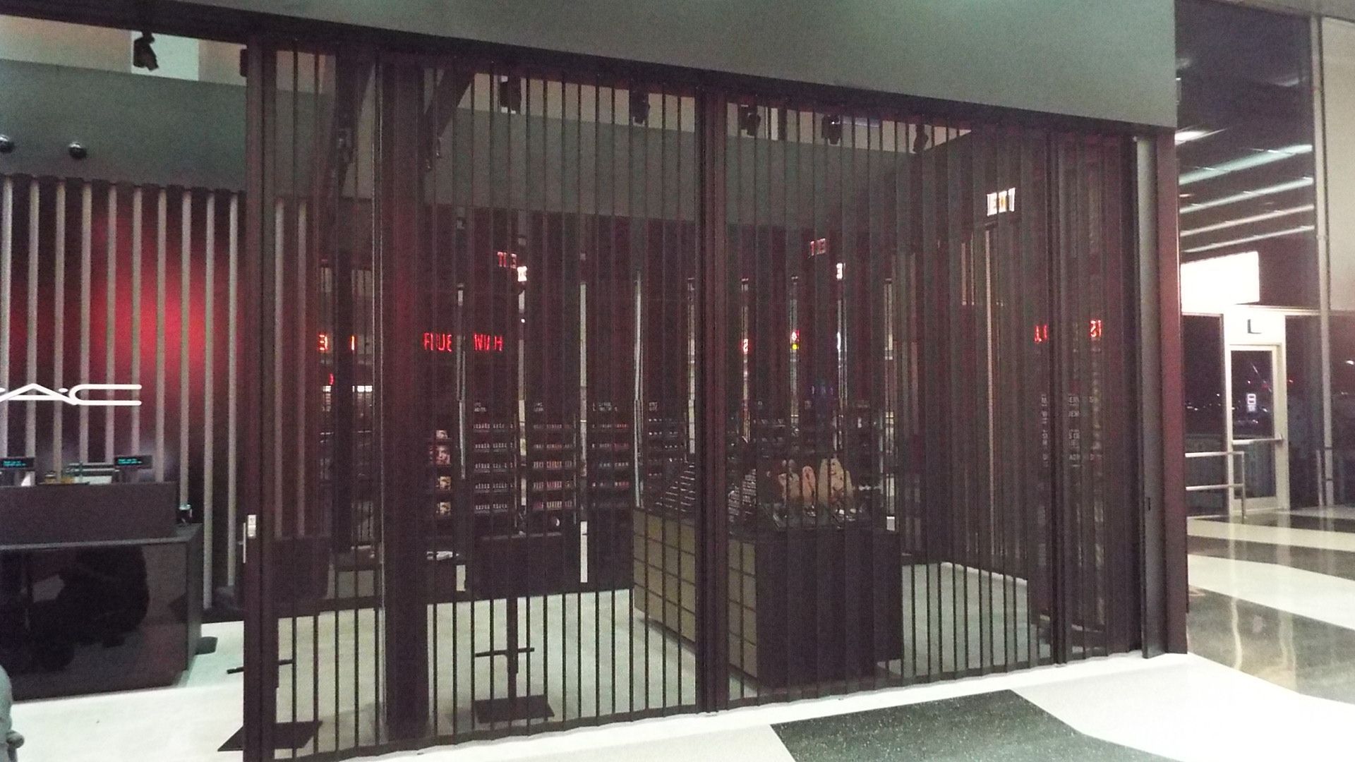 A restaurant with a sliding glass door and a counter behind it.