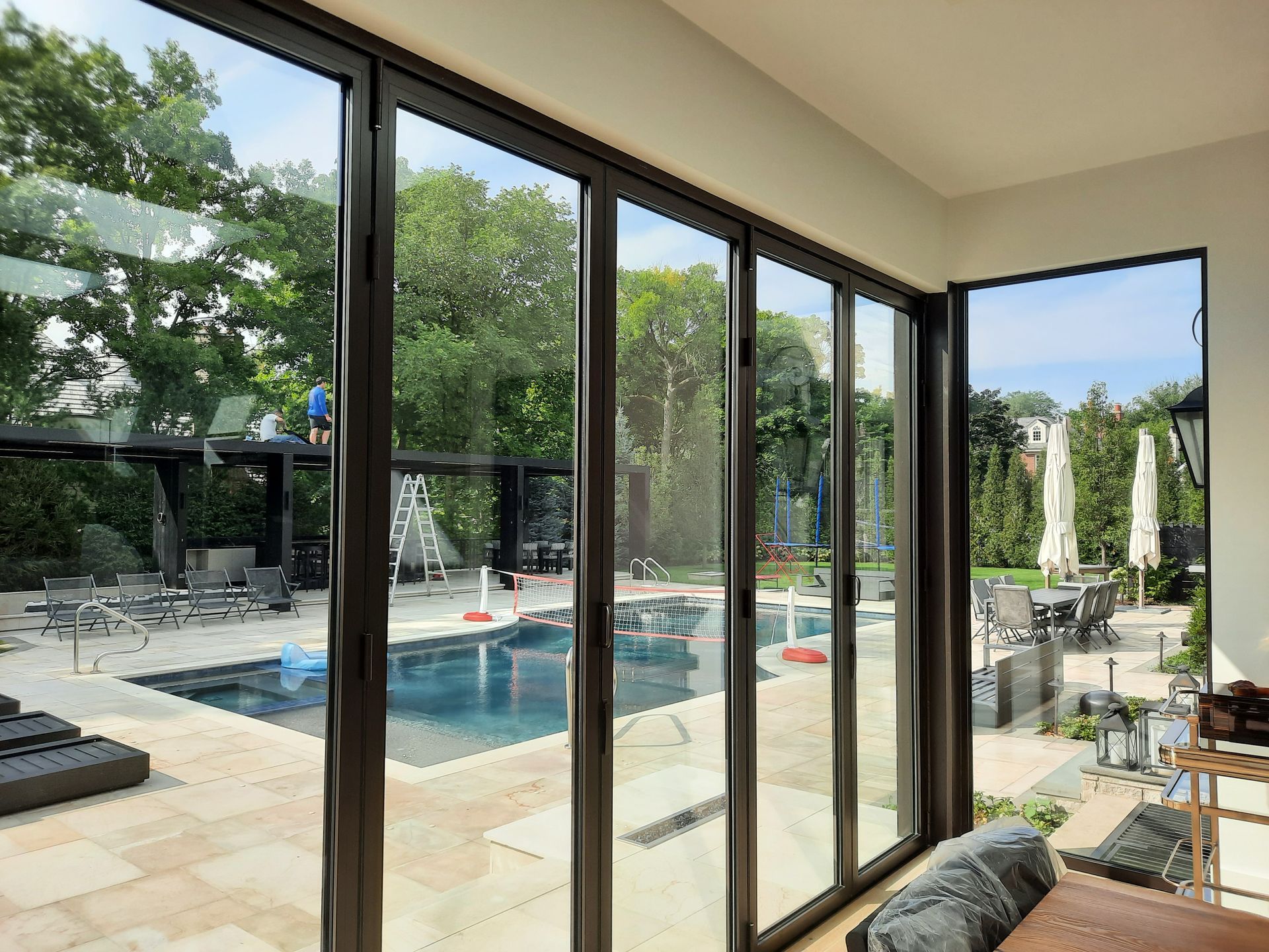 A sliding glass door with a metal gate on it
