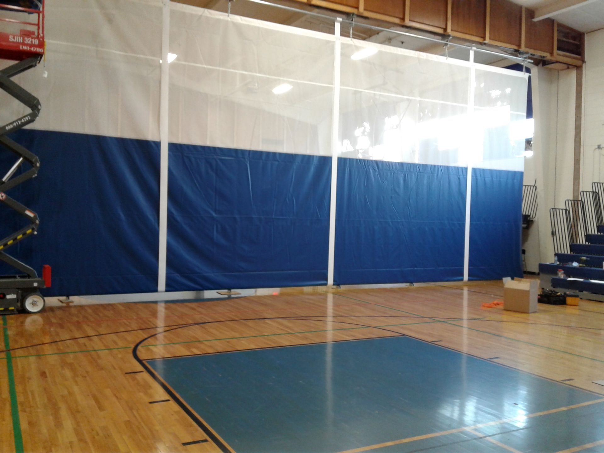 A large empty building with a lot of windows and columns.