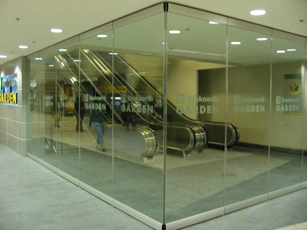 A large empty building with a lot of windows and columns.
