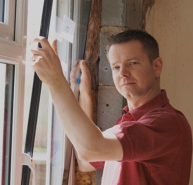 Man installing window — Glass Replacement in Spokane, WA