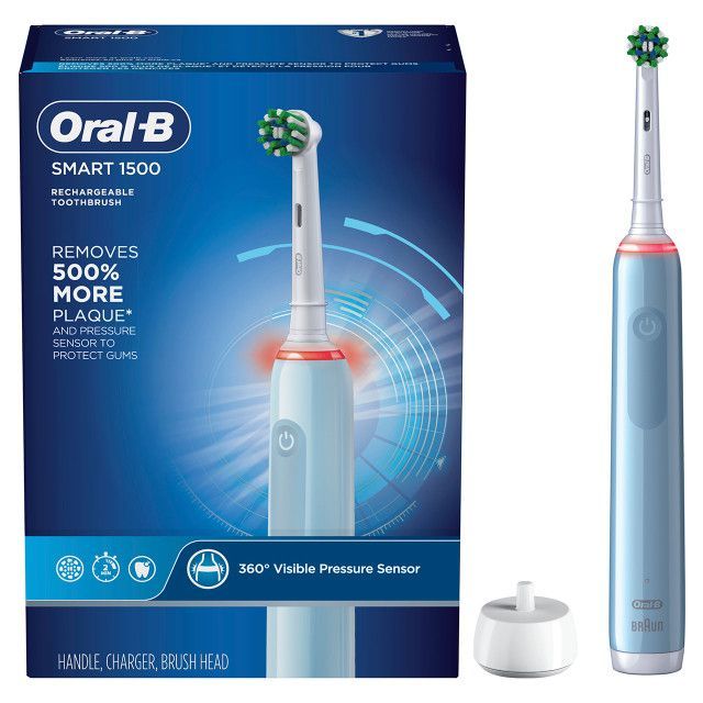 An oral b smart 1500 electric toothbrush with a charger