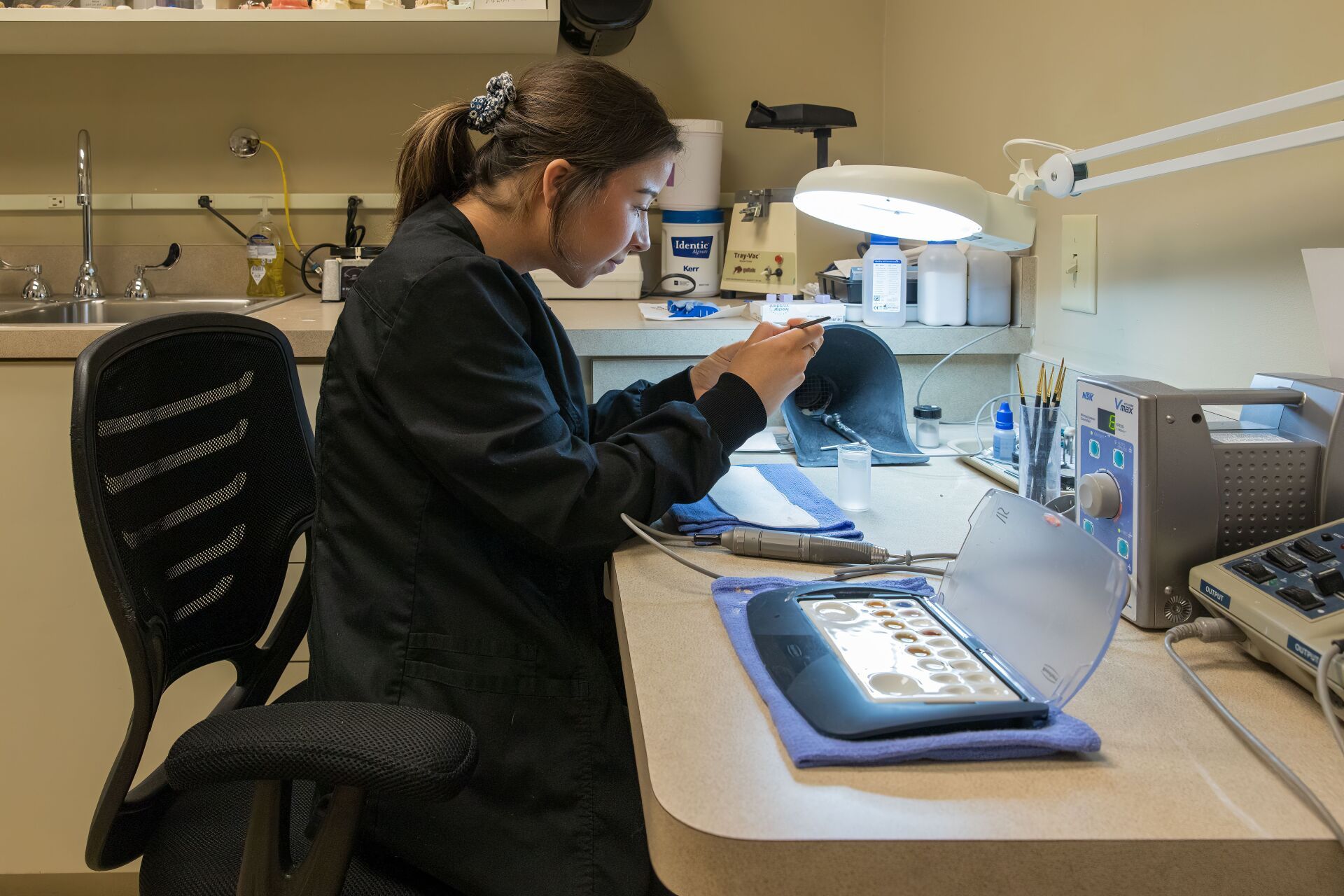 Doctor Checking in microscope